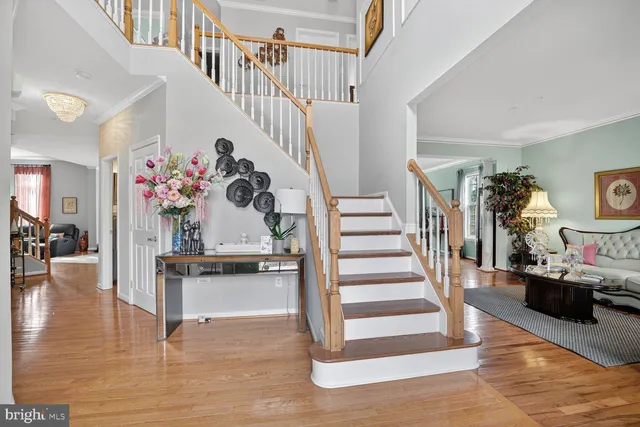 a view of entryway livingroom and hallway with wooden floor