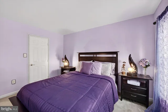 a bedroom with a bed and a mirror