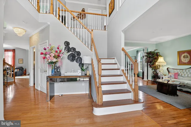 a view of entryway livingroom and hall with wooden floor