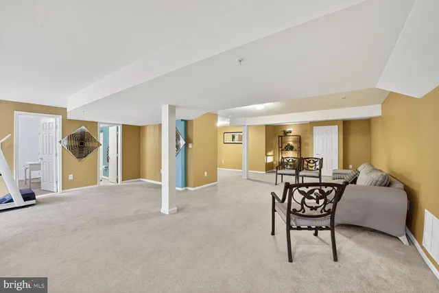 a view of a livingroom with furniture and a flat screen tv