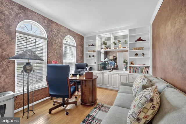a view of a livingroom with furniture and a window