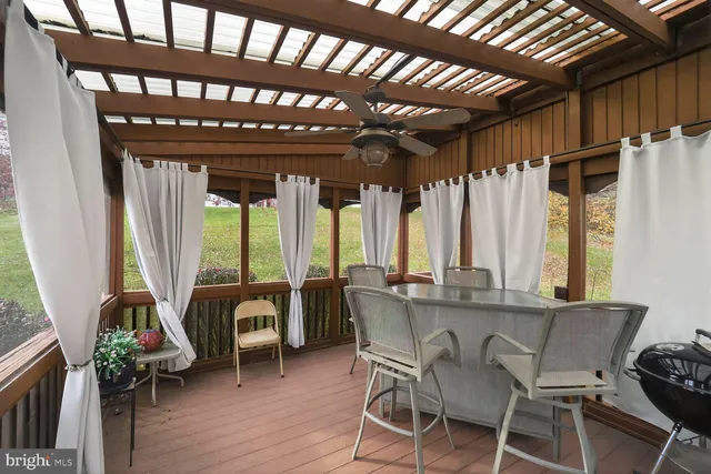 a very nice looking living room with a large window and furniture