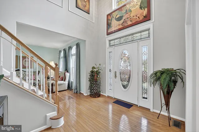a view of a hallway with paintings on the wall