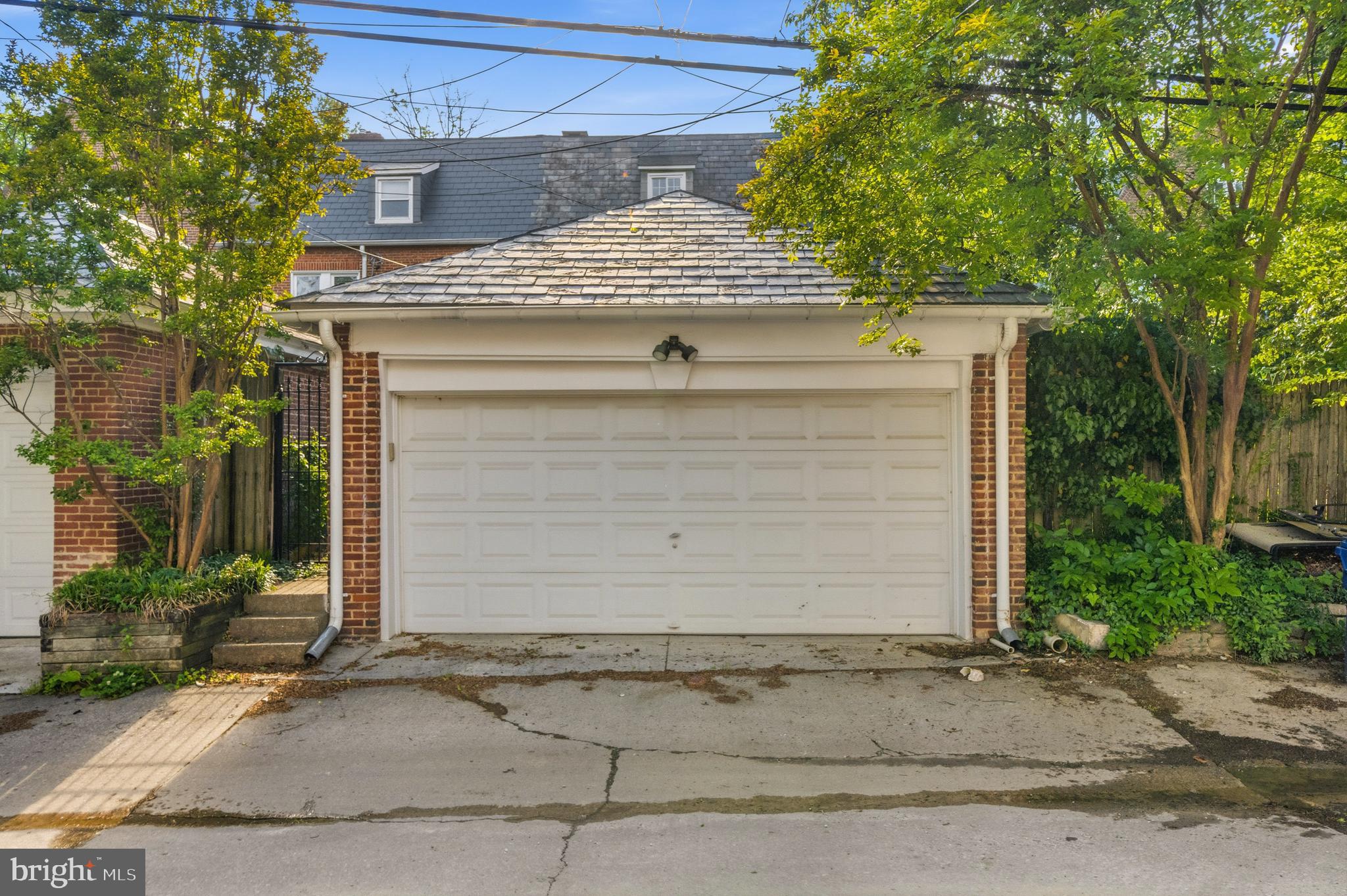 3539 Newland Road Baltimore, MD 21218 - Photo 32 of 37 a front view of a house with a yard and garage