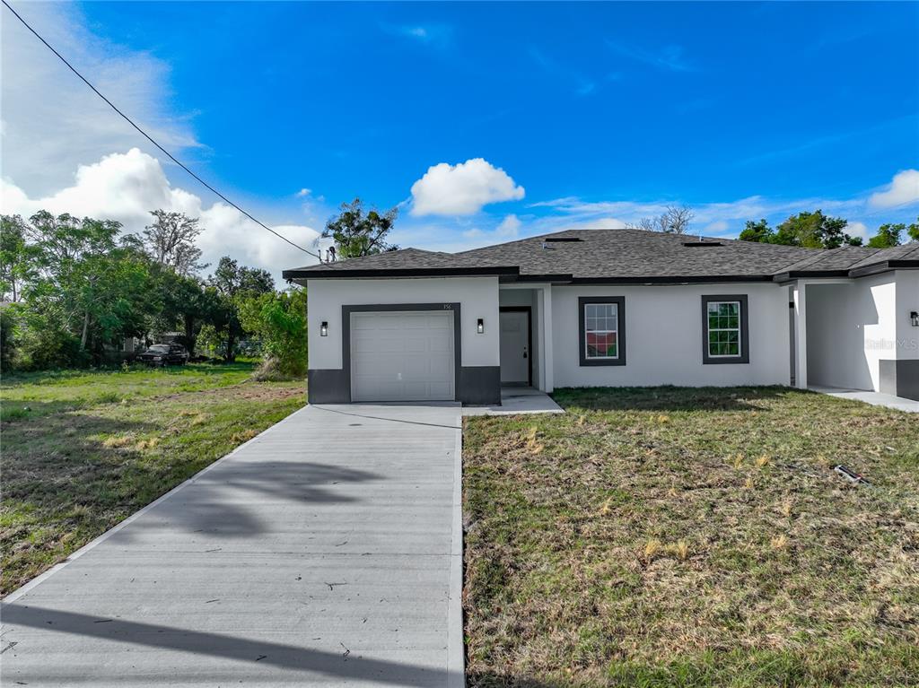 356 West 4th Street Apopka, FL 32703 - Photo 1 of 32 a front view of a house with garden