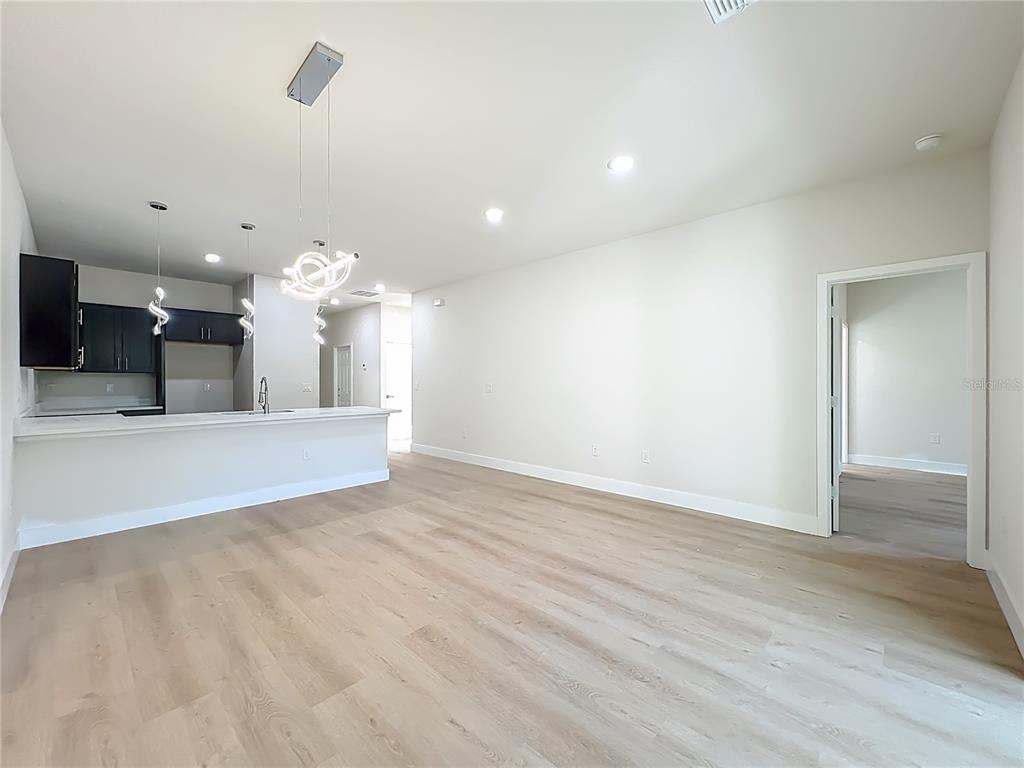 356 West 4th Street Apopka, FL 32703 - Photo 16 of 32 a view of a livingroom with kitchen