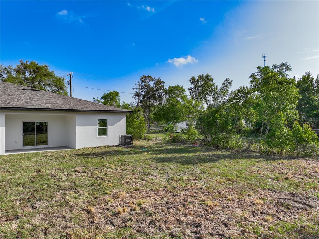 356 West 4th Street Apopka, FL 32703 - Photo 3 of 32 a house that has a tree in front of it
