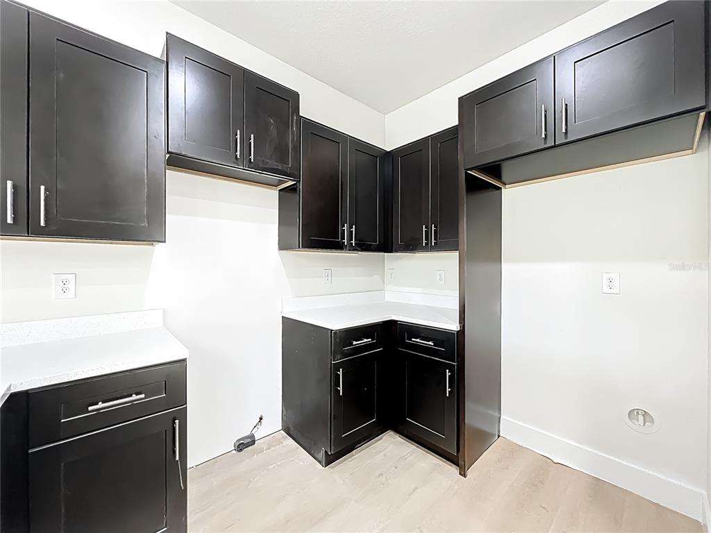 356 West 4th Street Apopka, FL 32703 - Photo 10 of 32 a kitchen with stainless steel appliances granite countertop a refrigerator and a sink
