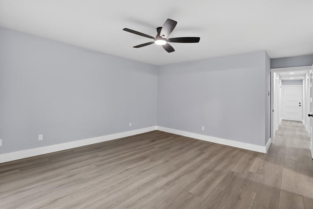 2005 Chestnut Road Carrollton, TX 75007 - Photo 27 of 35 a view of an empty room with wooden floor