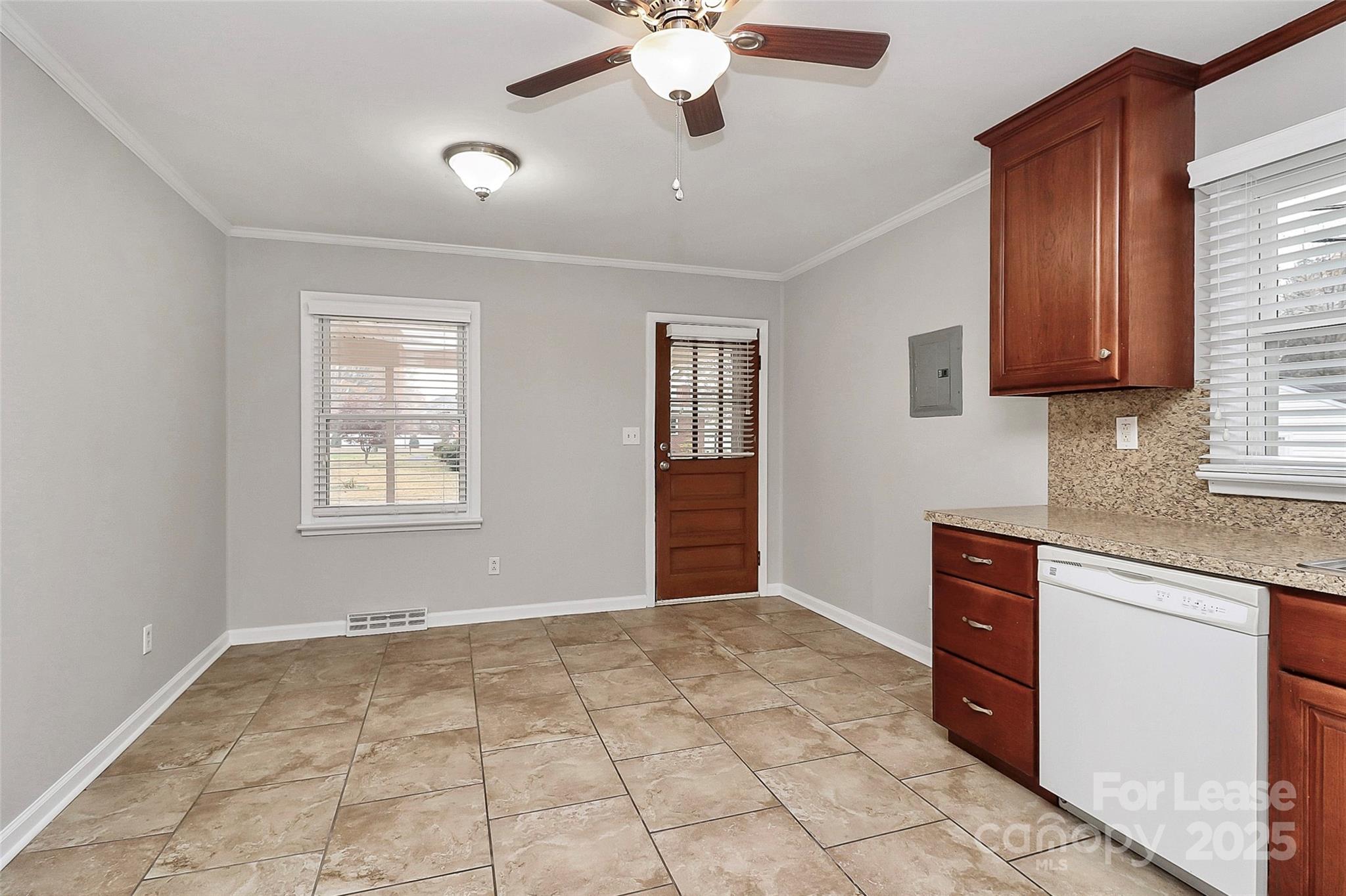 8911 Reames Road Charlotte, NC 28216 - Photo 13 of 31 a view of an empty room with window and cabinet