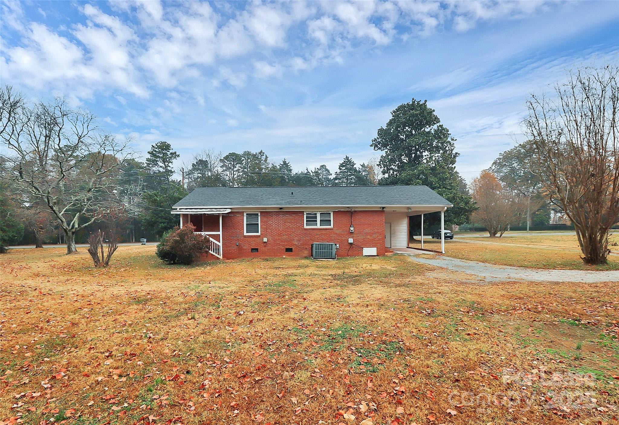 8911 Reames Road Charlotte, NC 28216 - Photo 28 of 31 a view of a house with a yard