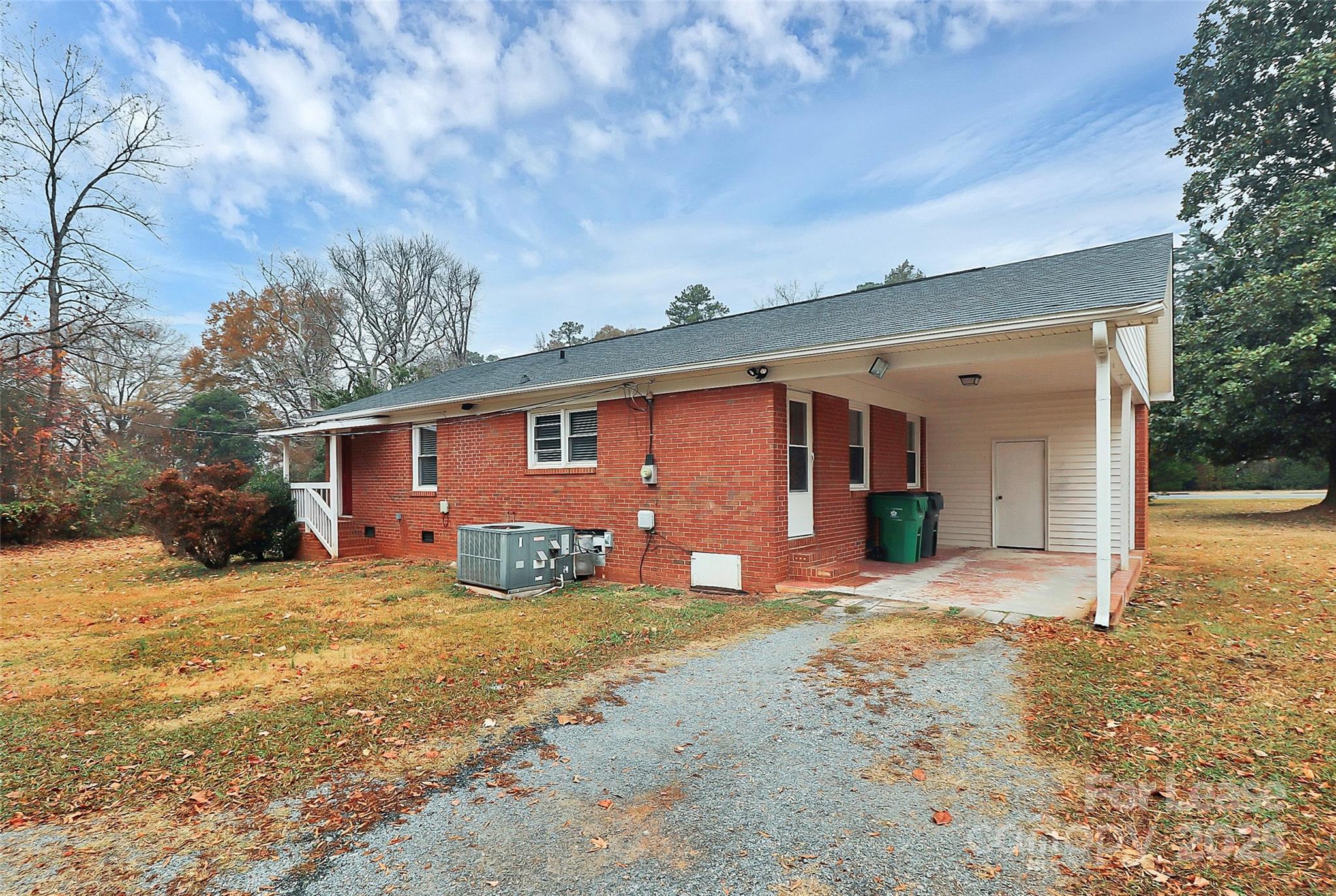 8911 Reames Road Charlotte, NC 28216 - Photo 29 of 31 a view of a house with a yard covered in snow