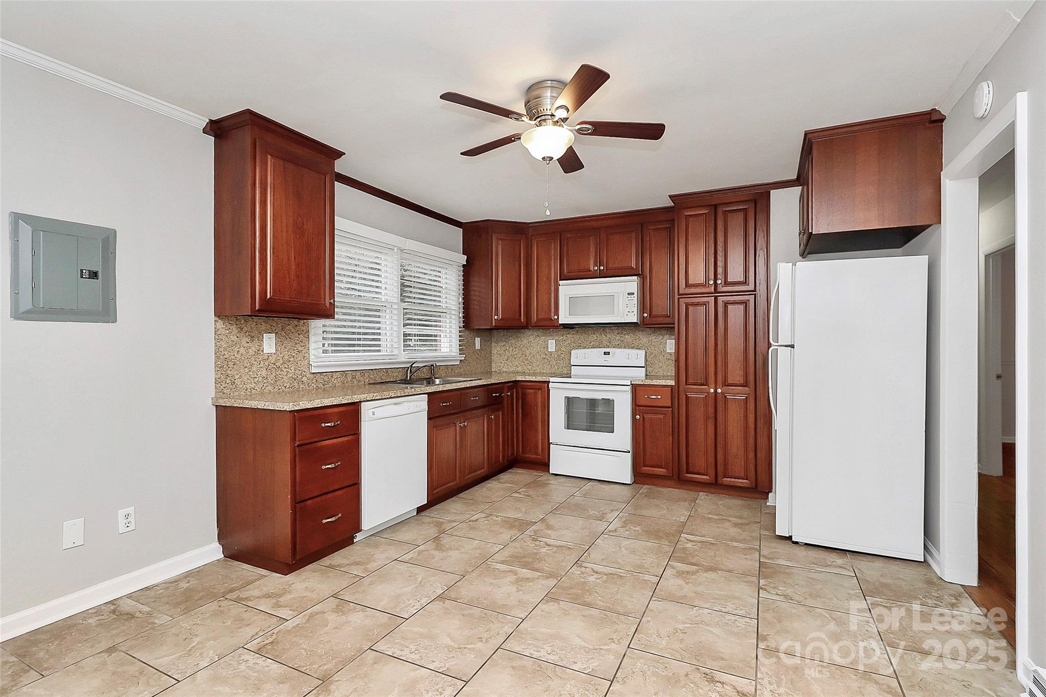 8911 Reames Road Charlotte, NC 28216 - Photo 10 of 31 a kitchen with stainless steel appliances granite countertop a refrigerator sink and cabinets