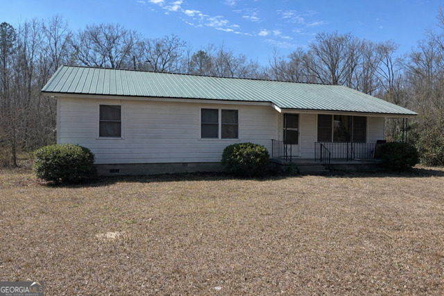 133 Black Creek Road Gordon, GA 31031 - Photo 2 of 8 a house view with a backyard space
