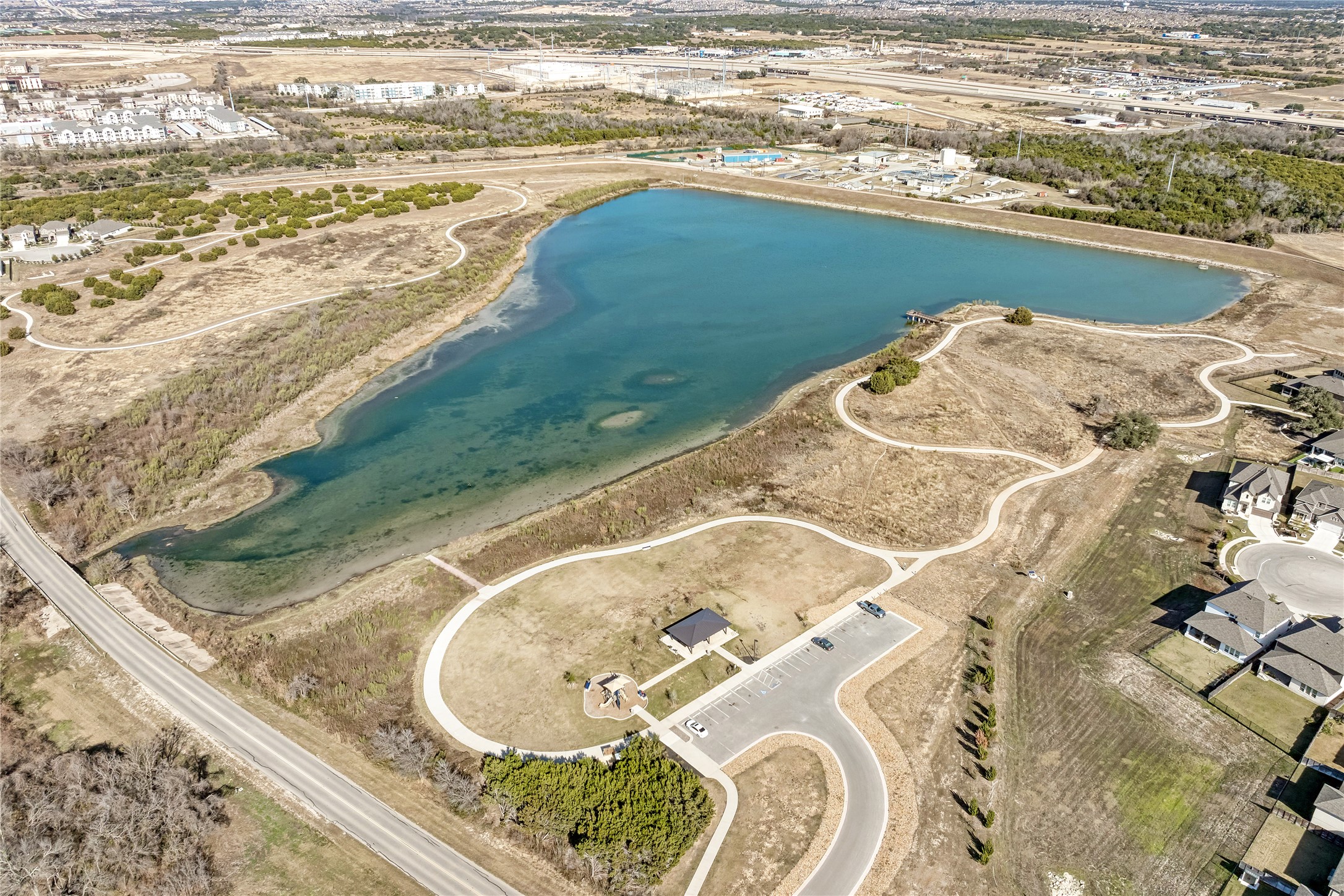 316 Regatta Trail Leander, TX 78641 - Photo 35 of 37 Expansive lake with surrounding natural landscape