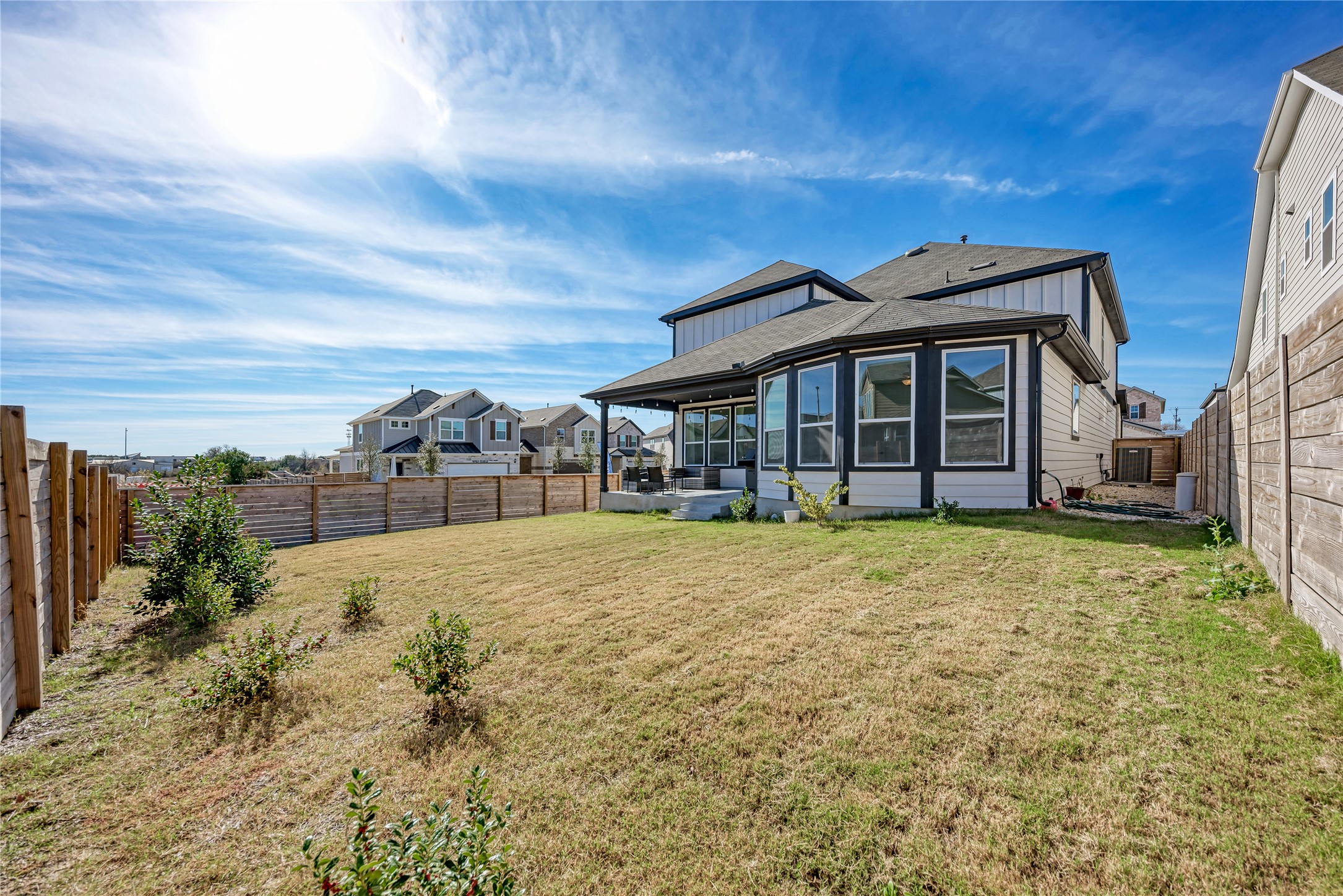 316 Regatta Trail Leander, TX 78641 - Photo 37 of 37 Expansive backyard featuring a sloped lawn and full privacy fencing
