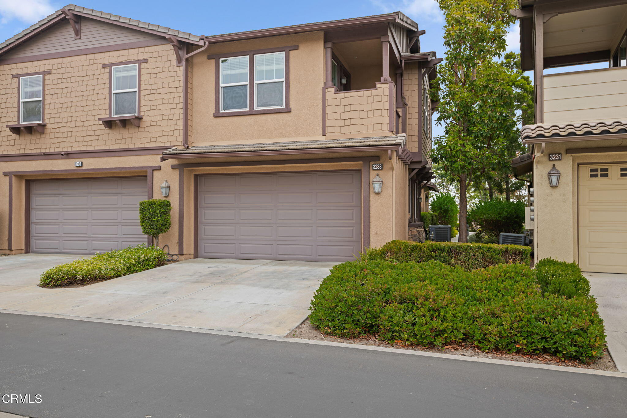 3233 Moss Landing Boulevard Oxnard, CA 93036 - Photo 20 of 25 a front view of a house with a yard and garage