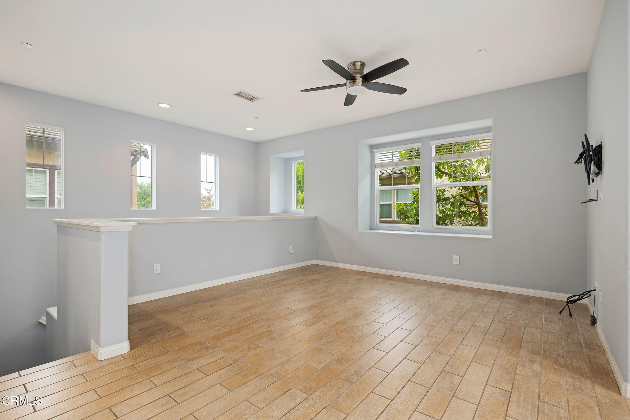 3233 Moss Landing Boulevard Oxnard, CA 93036 - Photo 2 of 25 a view of an empty room with a window and wooden floor