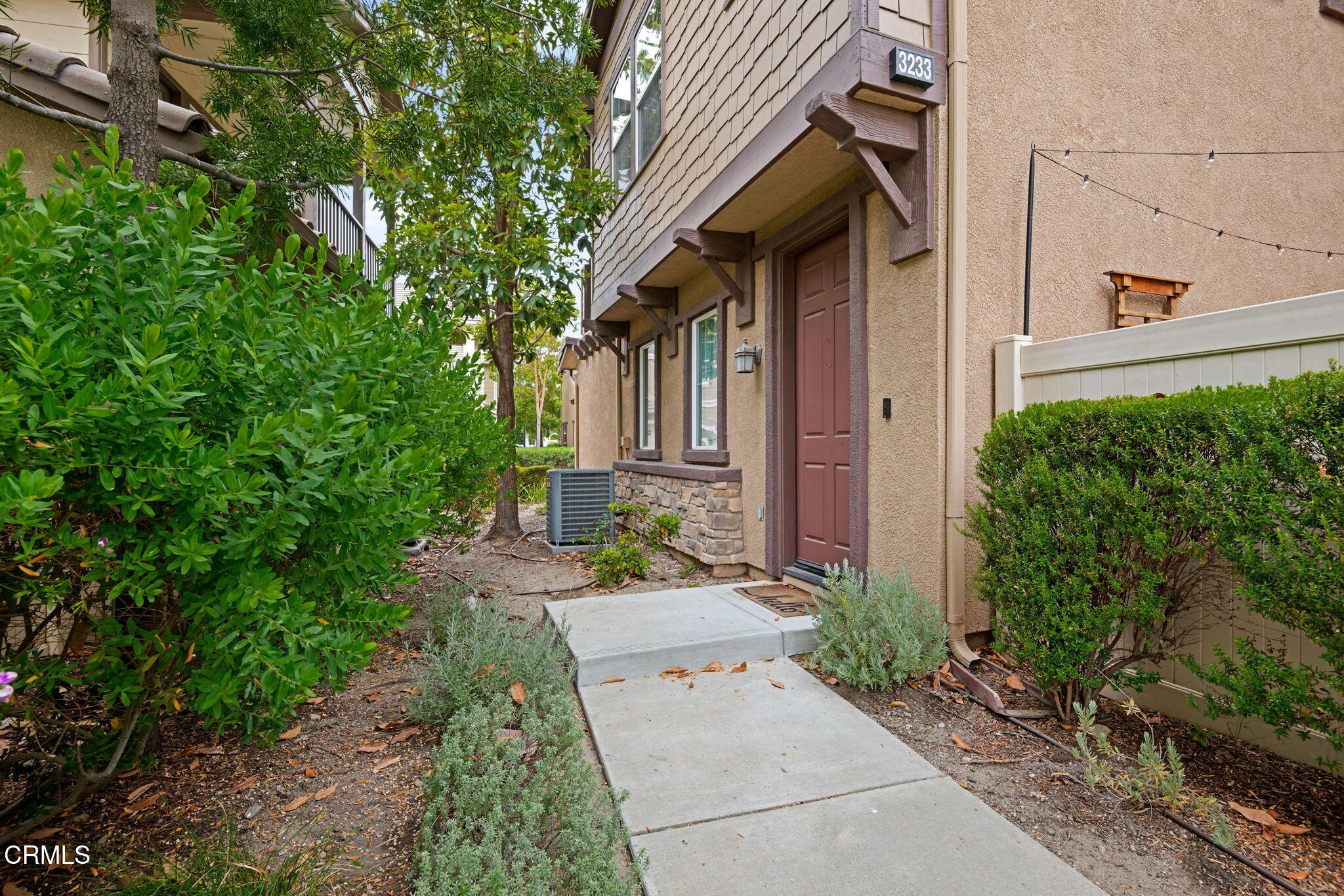 3233 Moss Landing Boulevard Oxnard, CA 93036 - Photo 21 of 25 a view of a brick house with a yard