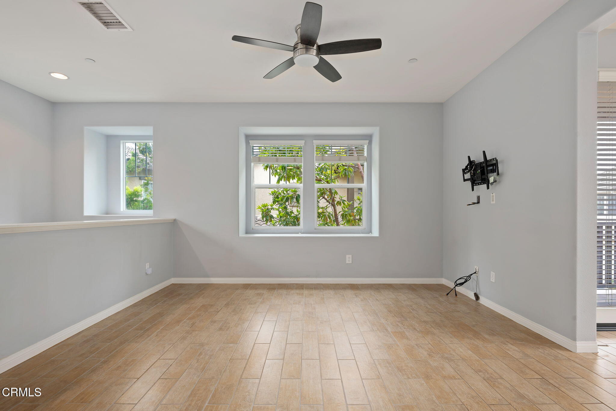 3233 Moss Landing Boulevard Oxnard, CA 93036 - Photo 3 of 25 an empty room with a window and a ceiling fan