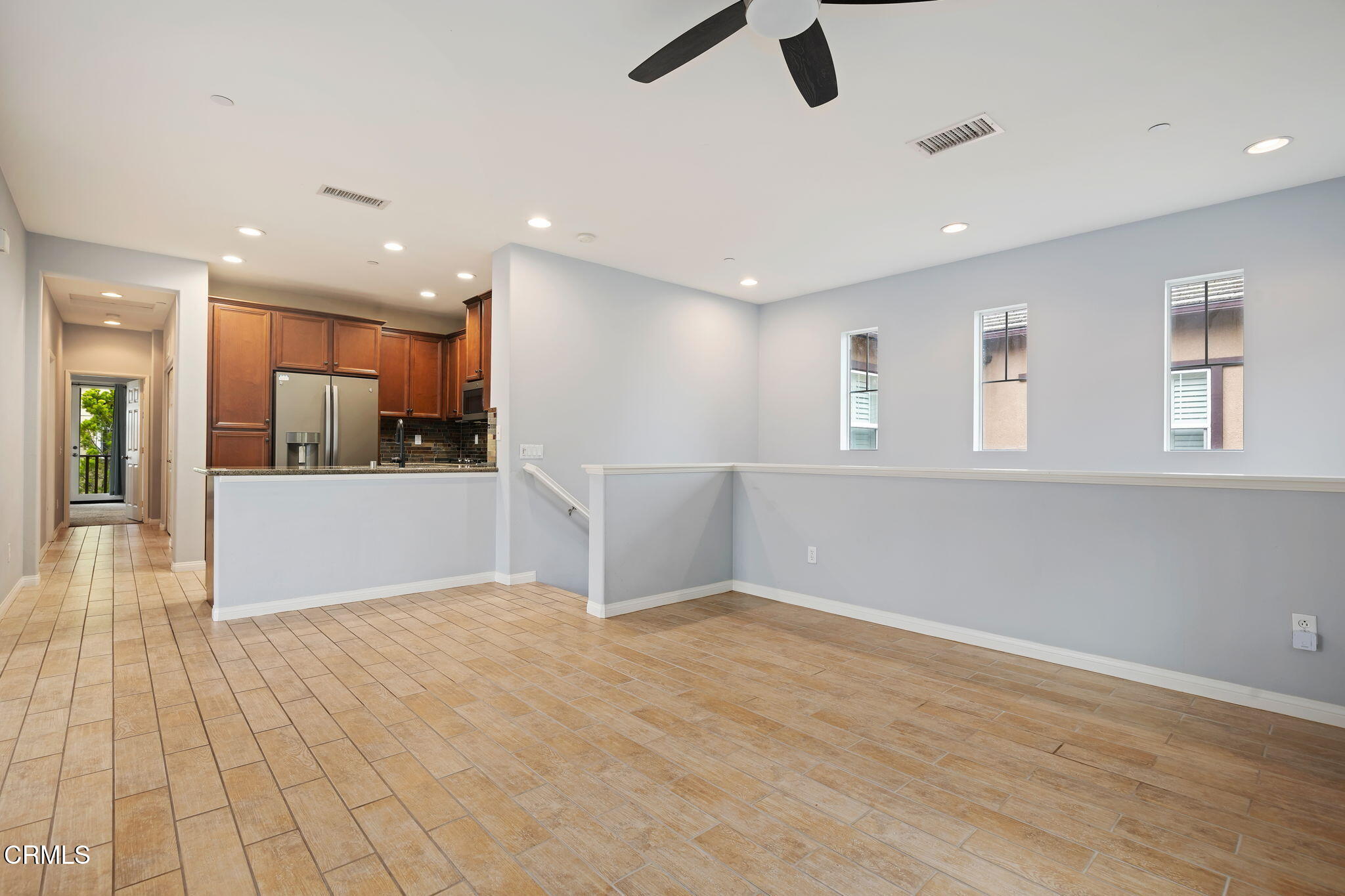 3233 Moss Landing Boulevard Oxnard, CA 93036 - Photo 6 of 25 wooden floor in an empty room with a kitchen