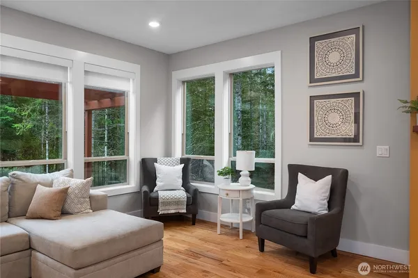 a living room with furniture and a large window