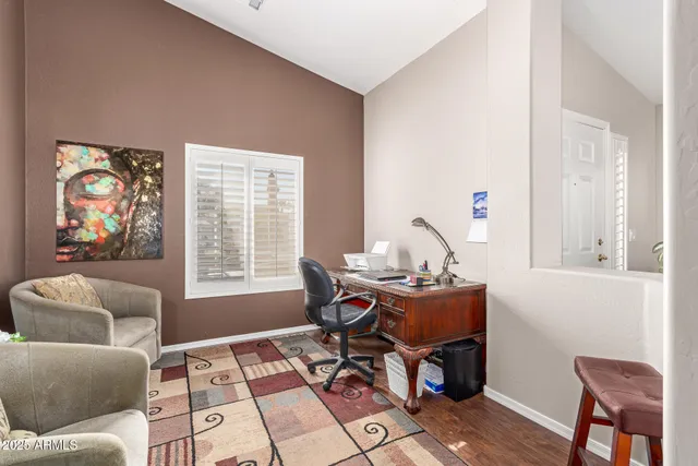 a work room with furniture and a window