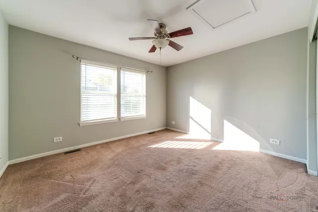 a view of a patio with table and chairs and potted plants