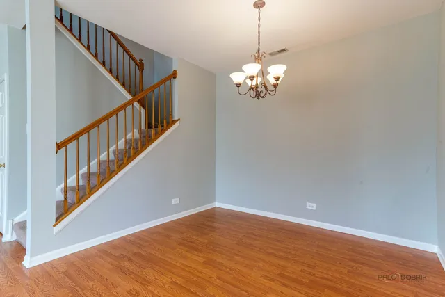 a kitchen with kitchen island granite countertop a stove top oven sink and cabinets
