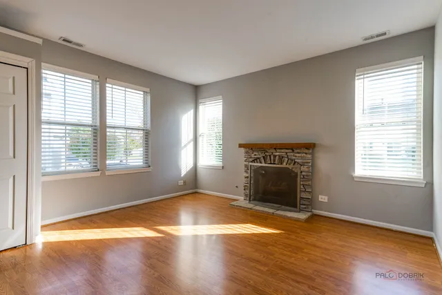 a bathroom with a granite countertop sink mirror and toilet