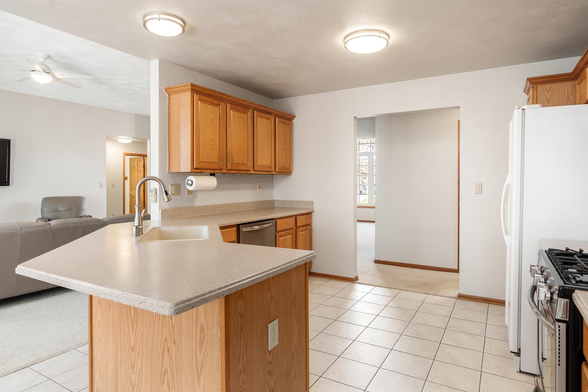 10703 Chicory Ridge Way Roscoe, IL 61073 - Photo 38 of 64 a kitchen with a sink a stove and a refrigerator