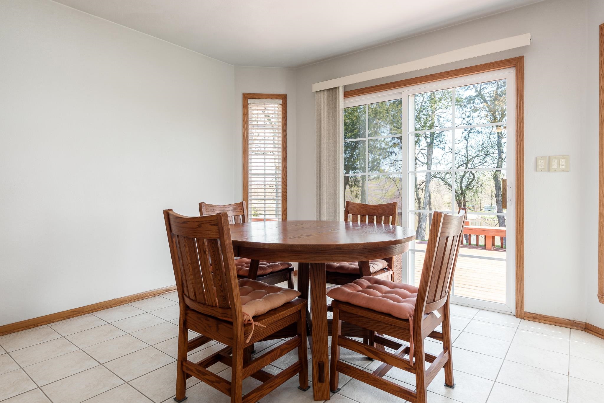 10703 Chicory Ridge Way Roscoe, IL 61073 - Photo 42 of 64 a view of a dining room with furniture and a window