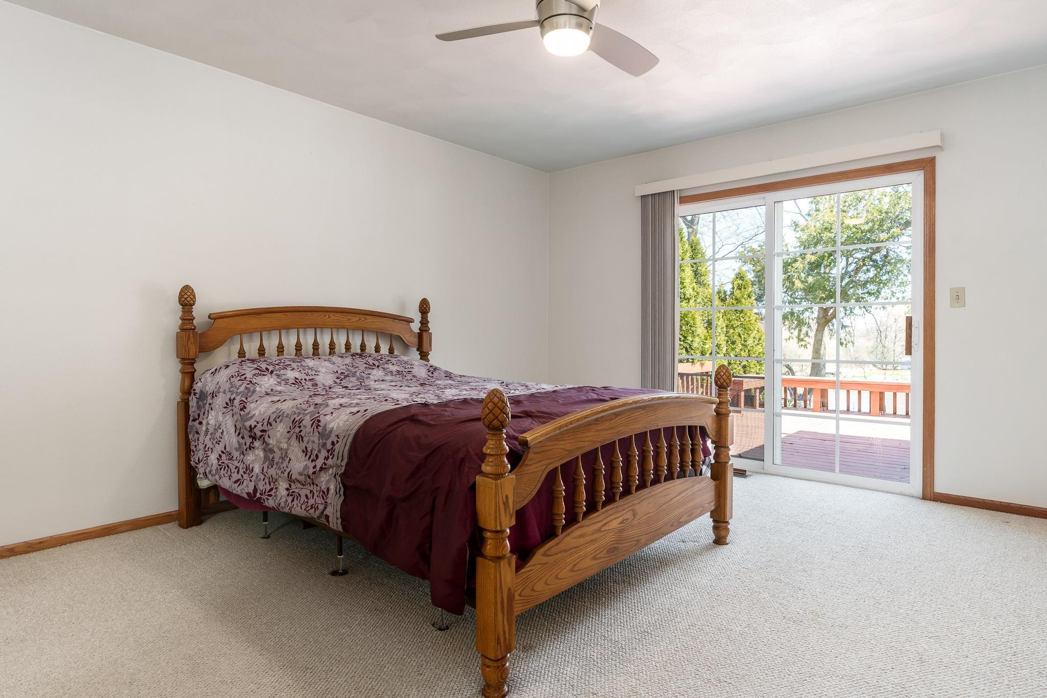 10703 Chicory Ridge Way Roscoe, IL 61073 - Photo 46 of 64 a bed sitting in a bedroom next to a window