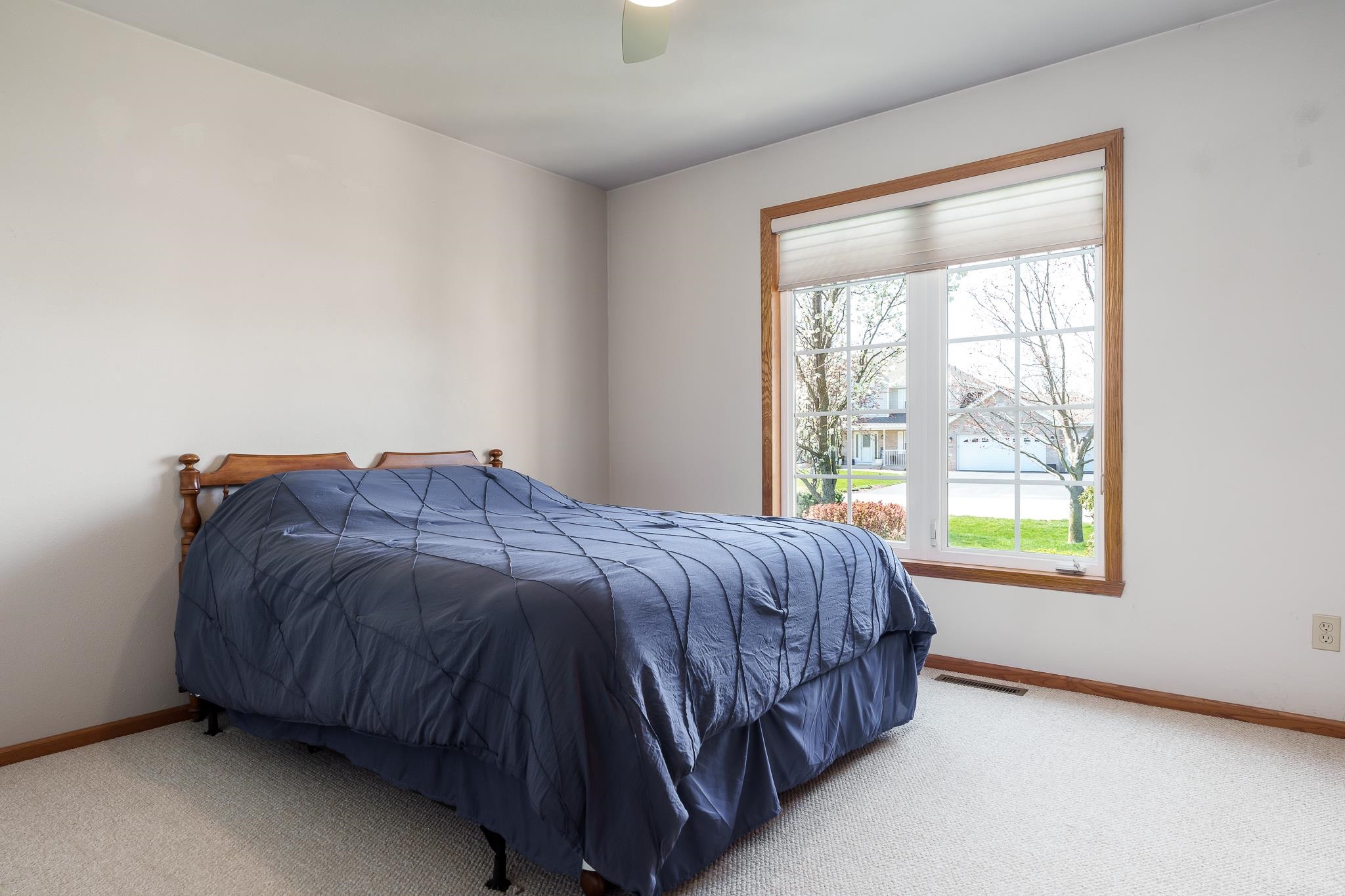 10703 Chicory Ridge Way Roscoe, IL 61073 - Photo 55 of 64 a bed sitting in a bedroom next to a window