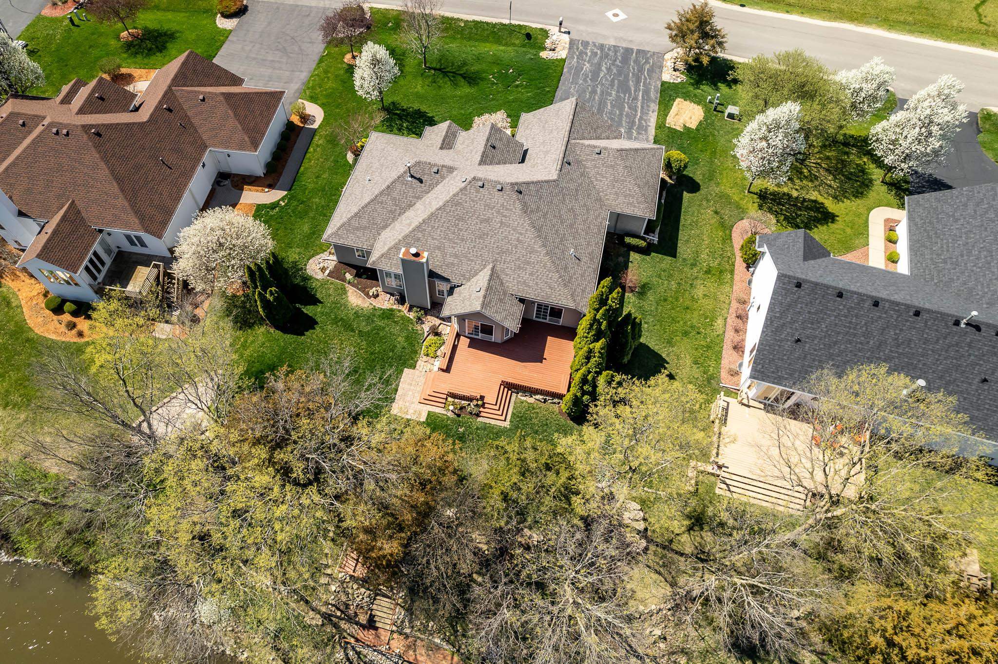 10703 Chicory Ridge Way Roscoe, IL 61073 - Photo 7 of 64 an aerial view of a house with a yard basket ball court and outdoor seating
