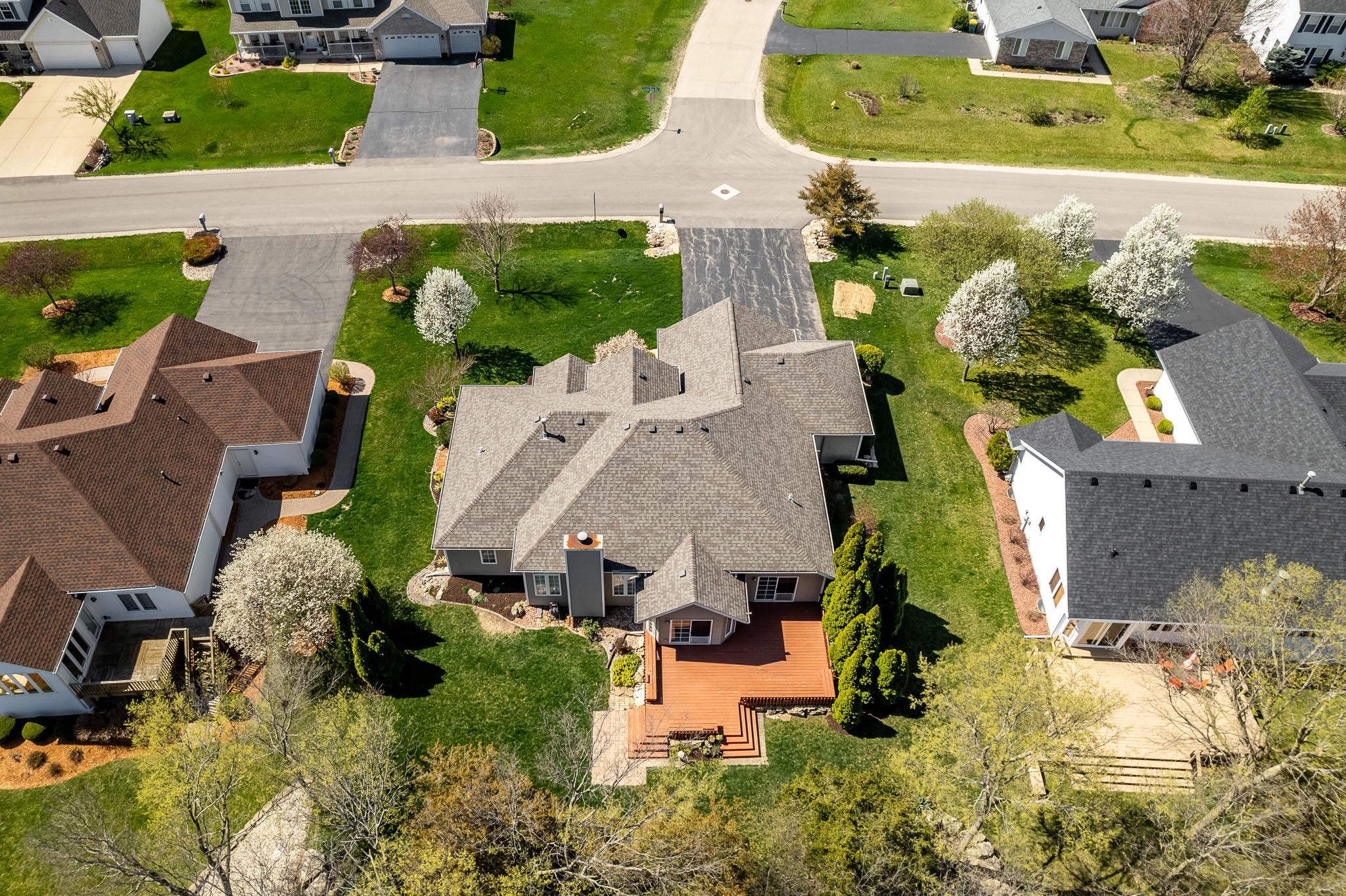 10703 Chicory Ridge Way Roscoe, IL 61073 - Photo 8 of 64 an aerial view of a house with a yard basket ball court and outdoor seating