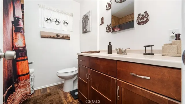 a bedroom with a bed a couch and dresser