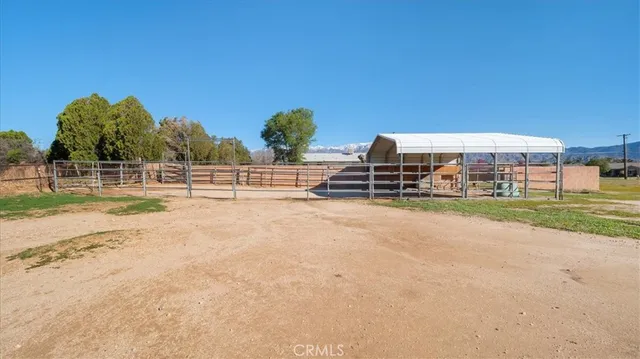 a view of outdoor space with deck and lake view