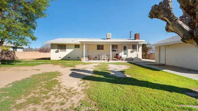 an aerial view of residential house with parking