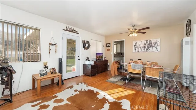 a view of a dining room with furniture and a table