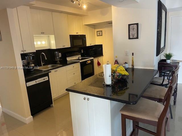 4400 Hillcrest Drive, Unit 701B Hollywood, FL 33021 - Photo 11 of 20 a kitchen with a sink appliances and cabinets