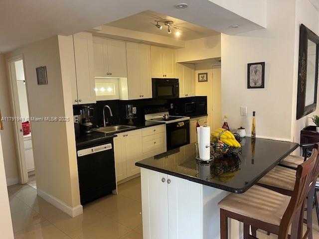 4400 Hillcrest Drive, Unit 701B Hollywood, FL 33021 - Photo 13 of 20 a kitchen with a sink stove and refrigerator