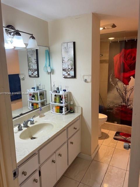 4400 Hillcrest Drive, Unit 701B Hollywood, FL 33021 - Photo 17 of 20 a bathroom with a sink a toilet and a mirror