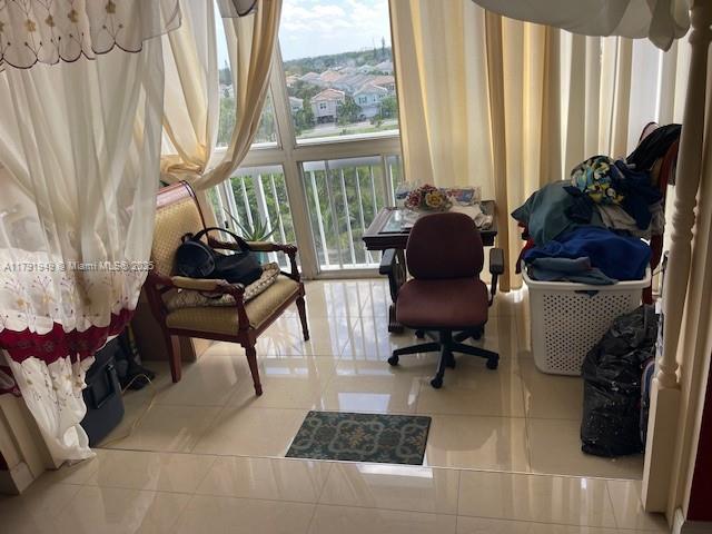 4400 Hillcrest Drive, Unit 701B Hollywood, FL 33021 - Photo 9 of 20 a living room with furniture and a large window