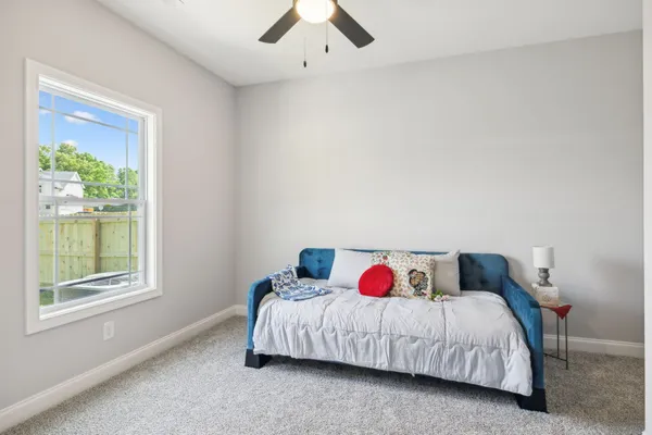 a bathroom with a bathtub and a toilet