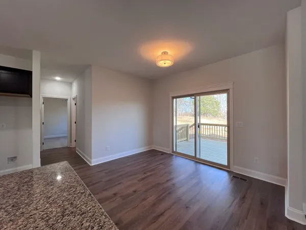 a kitchen with stainless steel appliances granite countertop a sink a stove top oven a counter space and cabinets