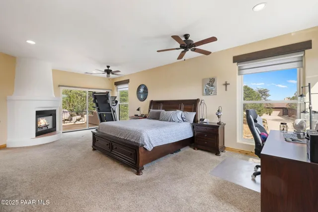 a bed room with a bed and a large window