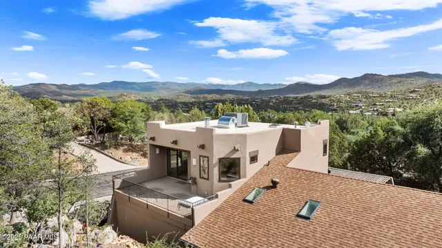 a view of a terrace with a table and chairs