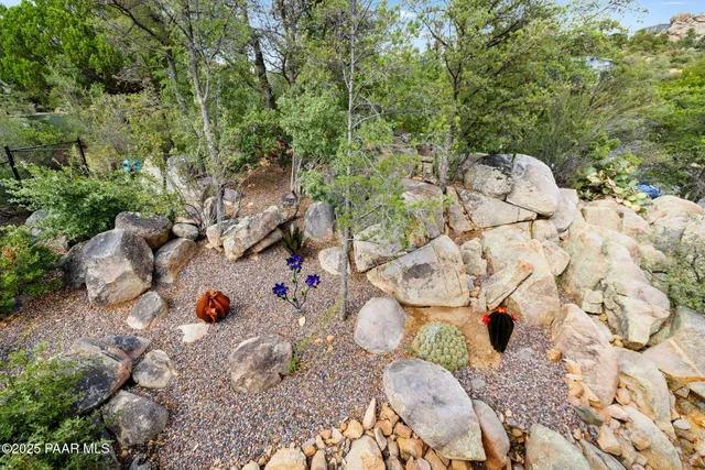a bathroom with a granite countertop tub sink and mirror
