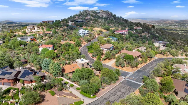 an aerial view of a house with a yard and garden